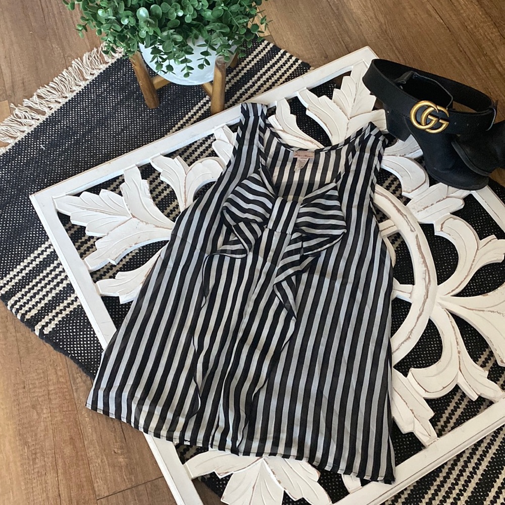 So cute black and white blouse with bow. Size medium.
